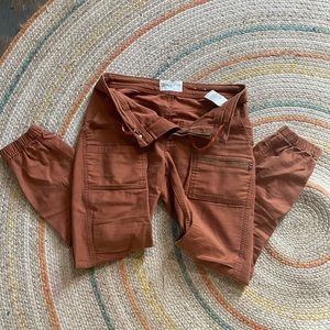 REI burnt orange cargo joggers.